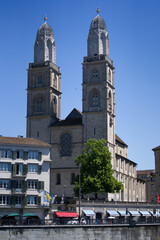 Obraz premium Old town of Zurich with church Grossmünster (German, translation is Great jMinster) at summertime. Photo taken June 1st, 2021, Zurich, Switzerland.