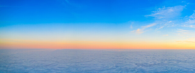 Orange dawn over the clouds. Aerial view. the other side of the sky.