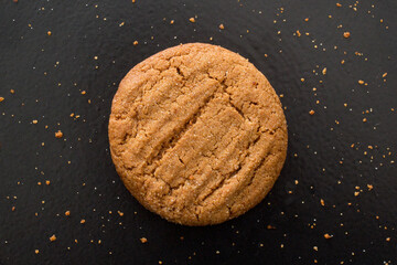 Ginger sparkle cookie on dark background.