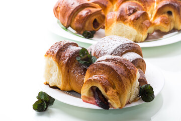 baked sweet homemade buns with plum inside