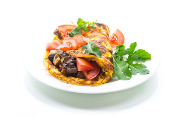 fried egg omelet with wild mushrooms and tomatoes
