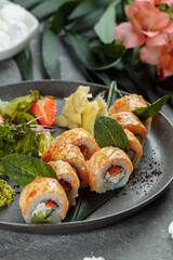 Maki Sushi - a roll of cream cheese, strawberries, avocado and fried salmon. Summer seasonal sushi rolls