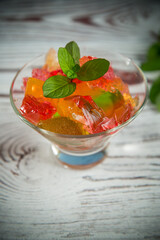 colored sweet fruit jelly in a glass glass