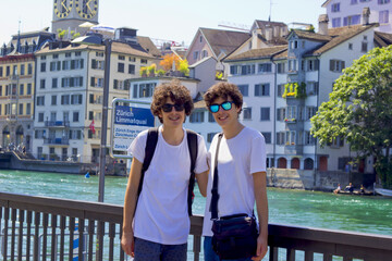 happy twins in a sunglasses in zurich in switzerland - obrazy, fototapety, plakaty