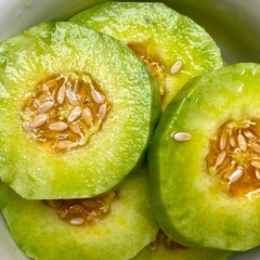 Closeup of sweet and delicious muskmelon pieces background, tasty juicy melon fruits for hot summer