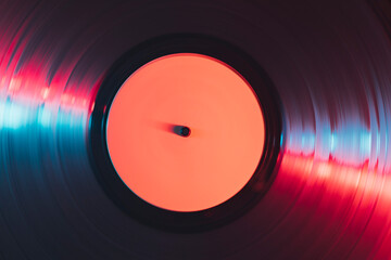 Close up of gramophone vinyl record playing music at night club.