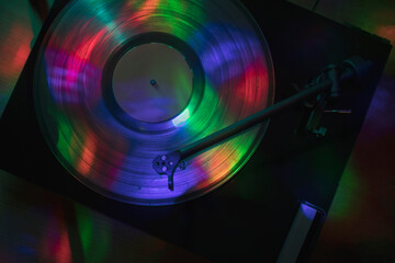 Turntable playing vinyl record at night club