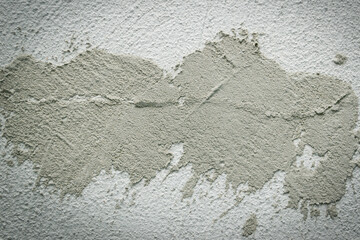 Concrete background. Plaster on the wall. Embossed textured surface.