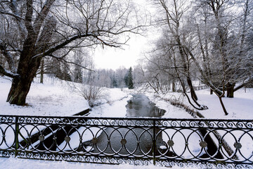 View of the Slavyanka River from the Black Bridge in the Pavlovsk Palace and Park Complex on a...