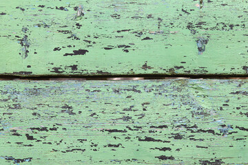 Background of an old wooden surface with peeling paint