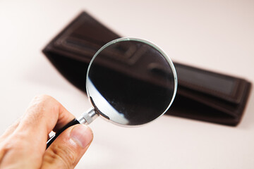 magnifier and empty wallet