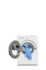 Studio shot of an open washing machine with clothes inside