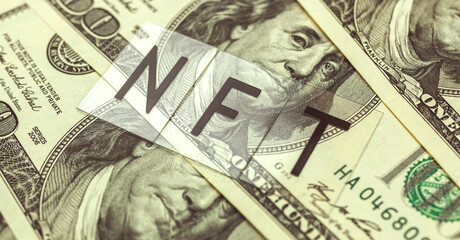 NFT non fungible token text message and dollar bills on the background