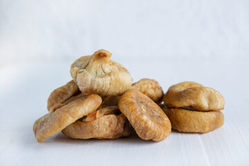 Sun-dried figs close-up on a light background. Healthy snacks