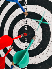 the red dart hit the center of the target