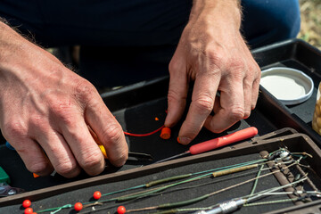 Close up photo of male hands with fishing gear