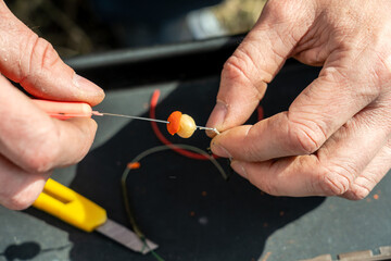 Close up photo of male hands with fishing gear
