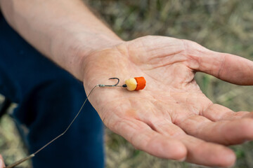 Close up photo of male hand with fishing gear