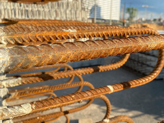 Iron metal rusty reinforcement in concrete and industrial reinforced concrete slabs used in the construction of buildings and structures