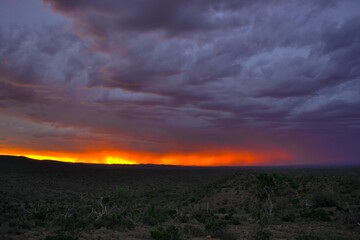 Naklejka na ściany i meble A special sunset in the Eastern Cape in the Karoo with the last light of day