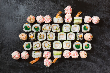 Sushi rolls set on a black background