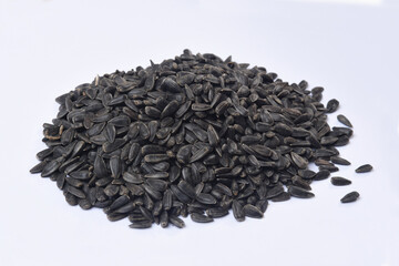 heap of black sunflower seeds isolated on white