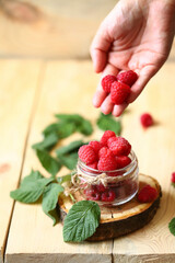 Fresh raspberries, raspberry leaves.