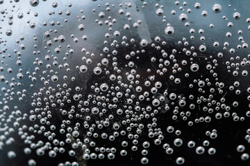 Abstract artistic background bubbles in a plastic bottle with drinking water close-up macro photography