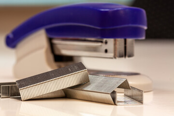 Closeup shot of a blue stapler on a white background