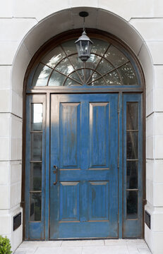 Bright royal blue exterior front door with architectural arch