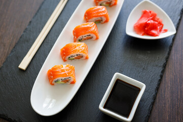 Sushi with fresh salmon served on the table