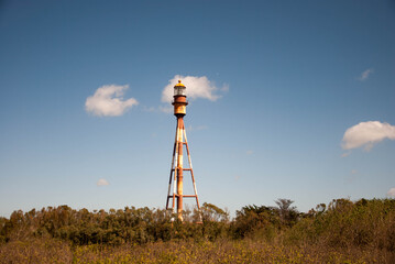 lighthouse with two clouds