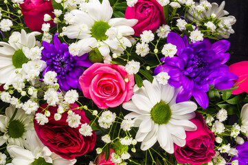 Background for a greeting card - beautiful gift bouquet of various colorful decorative summer flowers