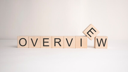 The word overview is written on wooden cubes on a light background. Business concept
