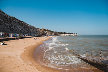 Beautiful sand beach in East England with wooden beach huts