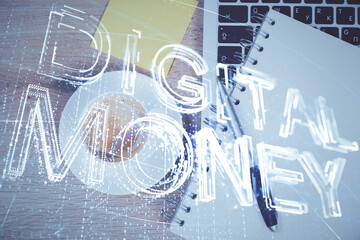 Blockchain theme hologram drawings over computer on the desktop background. Top view. Multi exposure. Concept of cryptoeconomy.