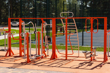Fototapeta na wymiar Equipment for outdoor sports, training in a public outdoor gym in a city park. Healthy Lifestyle Concept