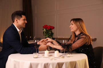 Lovely couple having romantic dinner in restaurant
