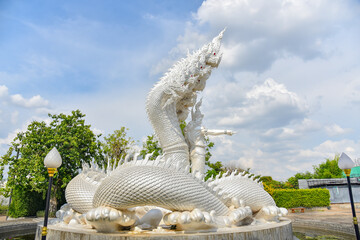 A sculpture depicting a male naka withe Giant Naga statue