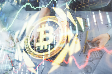 Double exposure of man and woman working together and crypto theme hologram drawing. Computer...