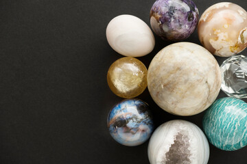 Crystal stone set on black background with space for your copy. Gemstones and crystals on dark...