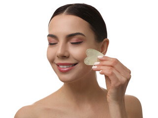 Beautiful young woman doing facial massage with gua sha tool on white background