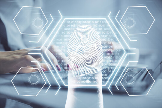 Double exposure of woman hands typing on computer and fingerprint drawing. Security concept.