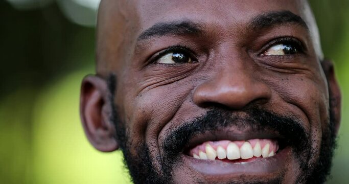 African man portrait face close-up smiling. Happy joyful black person