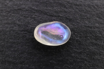 Shimmerstone jewel stone texture on white light isolated background. Macro closeup.