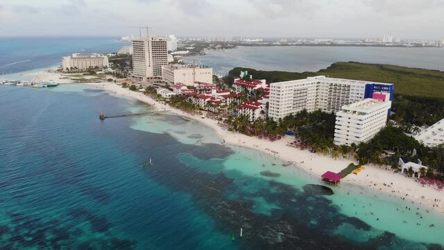 Aerial drone video of Playa Langosta, a papular  Caribbean sea beach in Cancun, Quintana Roo, Mexico