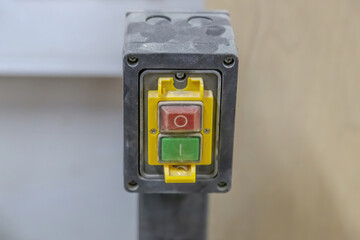Electrical switch with buttons for turning off and on the machine and industrial equipment