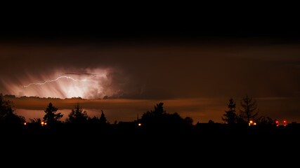 Fototapeta na wymiar View of lightning bolts in the night sky