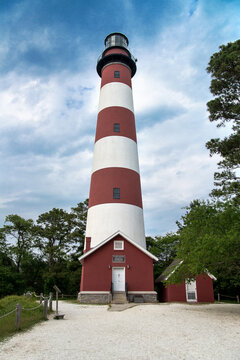 Lighthouse against the blue sky. Assateague Island. Historical monument in Virginia USA.