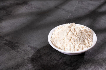 Fortified wheat flour in the bowl - Text space